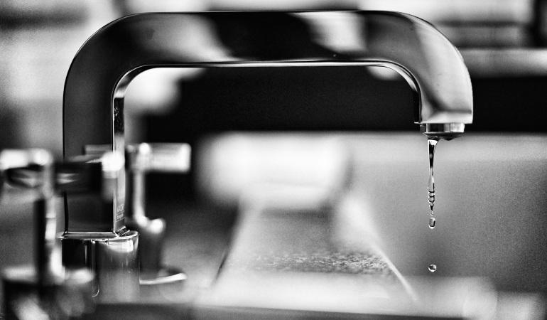 Faucet in black and white.