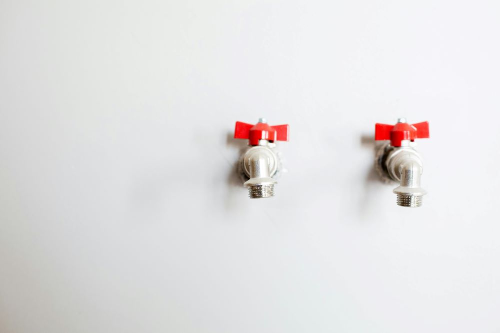 Two valves on the white wall