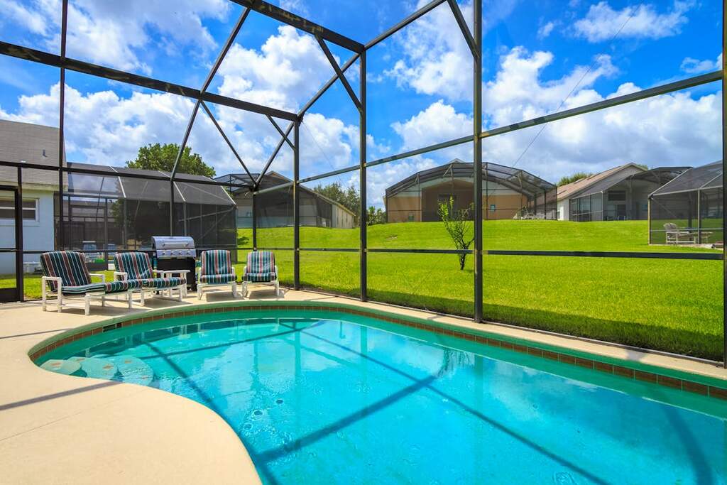 a pool overlooking the lawn